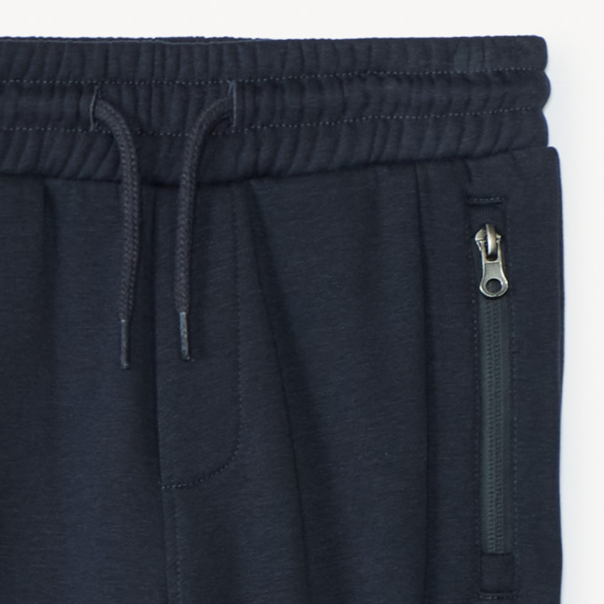 Pantalón de chándal de felpa lisa con bolsillos con cremallera para niño 