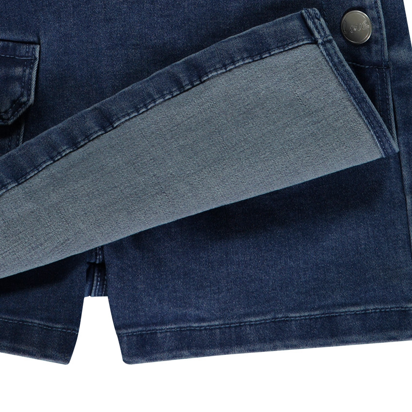 Pelele corto de mezclilla efecto vestido para niña 