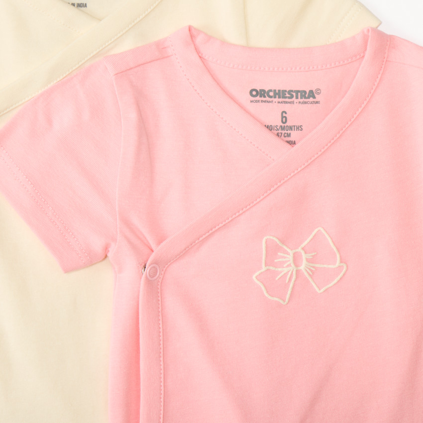 Conjunto de 7 bodies de manga corta con diseño de lazo para niña, apertura diferente según la edad. 