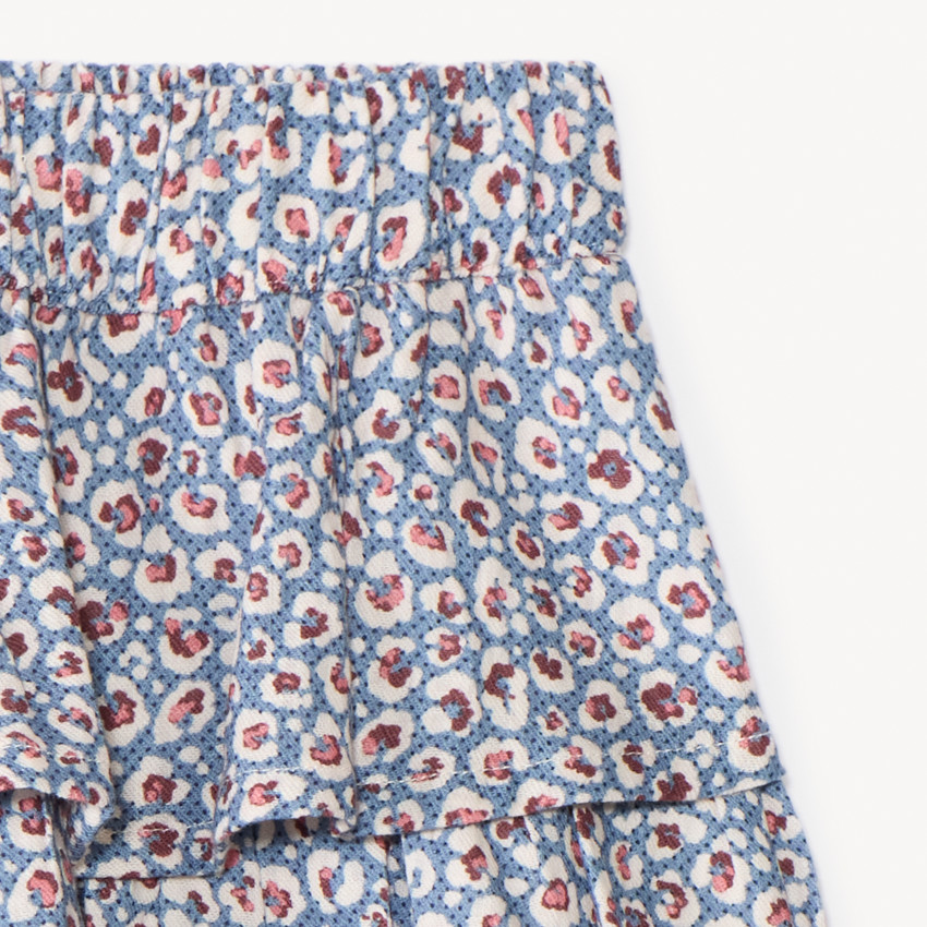 Falda corta con volantes y estampado fantasía niña 
