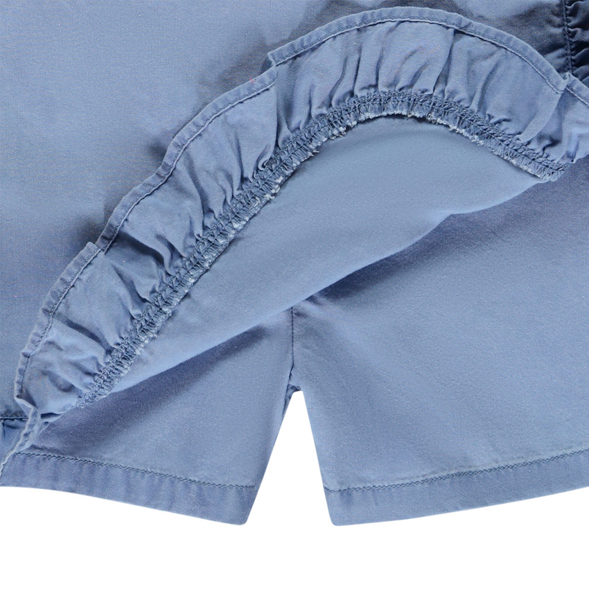 Falda corta lisa en Tencel con volantes para niña. 