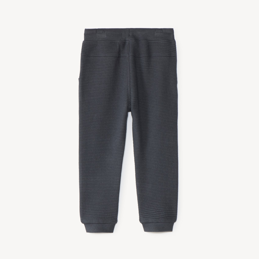 Pantalón de chándal para bebé niño con tejido de panal y estampado de oso. 