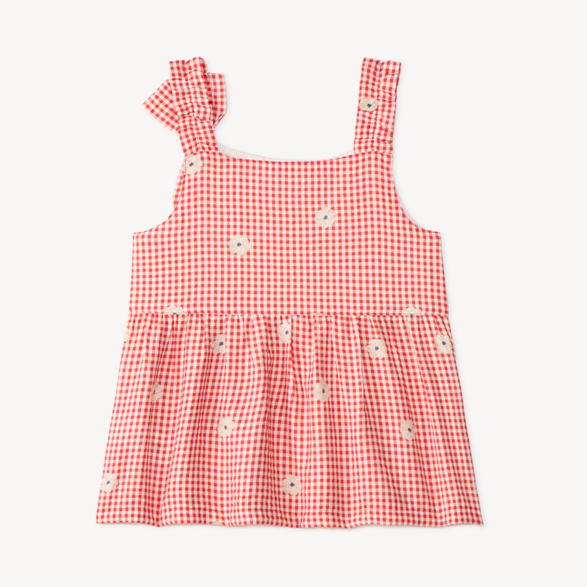 Top de niña vichy con lazo en el hombro y bordado floral. 