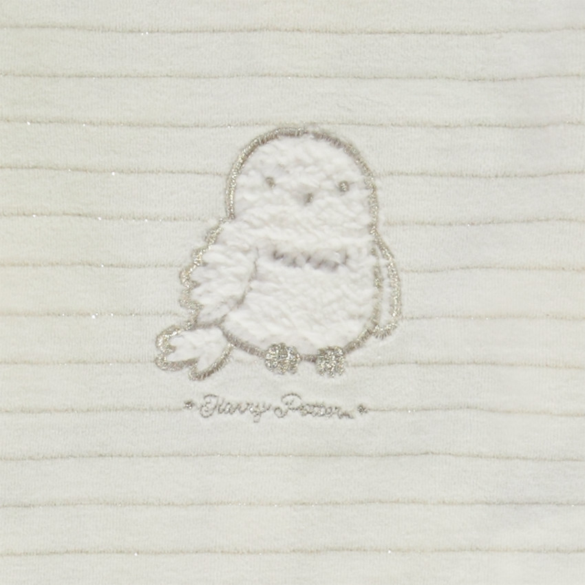 Pelele patch Hedwig Warner para bebé niña con aperturas diferentes según la edad 