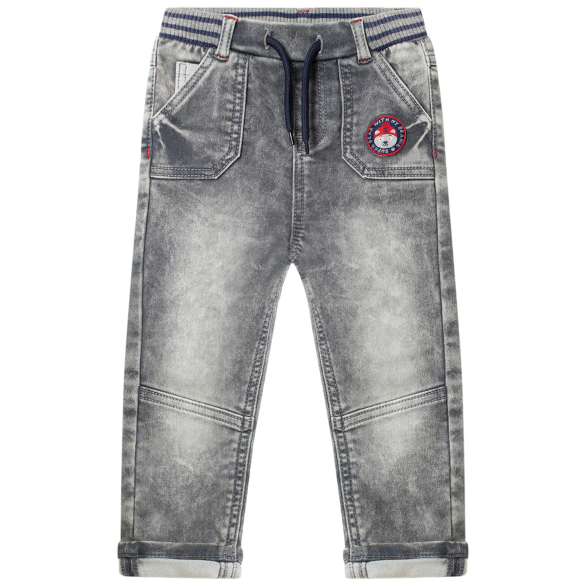 Jean effetused à badge et taille élastiquée 