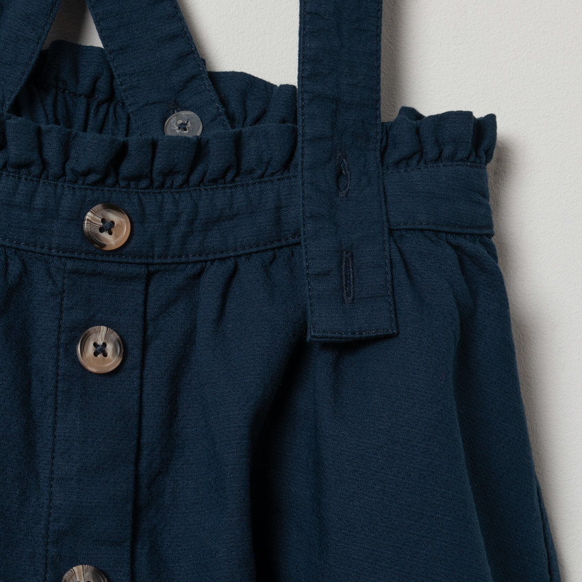 Jupe en toile à bretelles croisées 