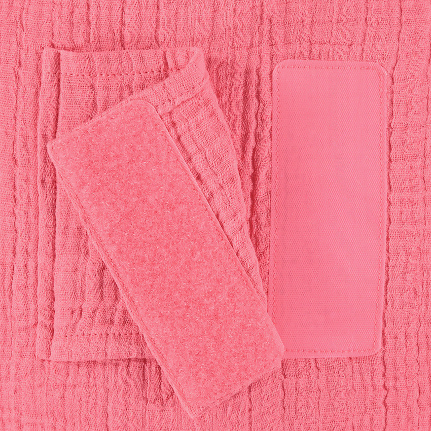 Cojín decorativo redondo en gasa de algodón modulable en protector de cuna o parque 