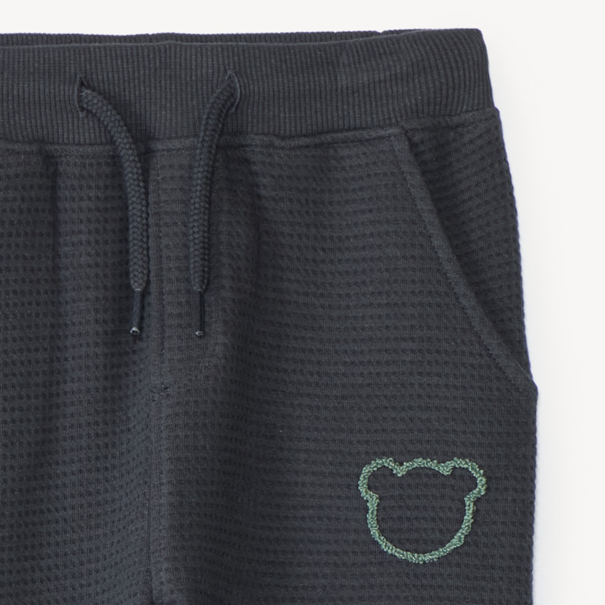 Pantalón de chándal para bebé niño con tejido de panal y estampado de oso. 