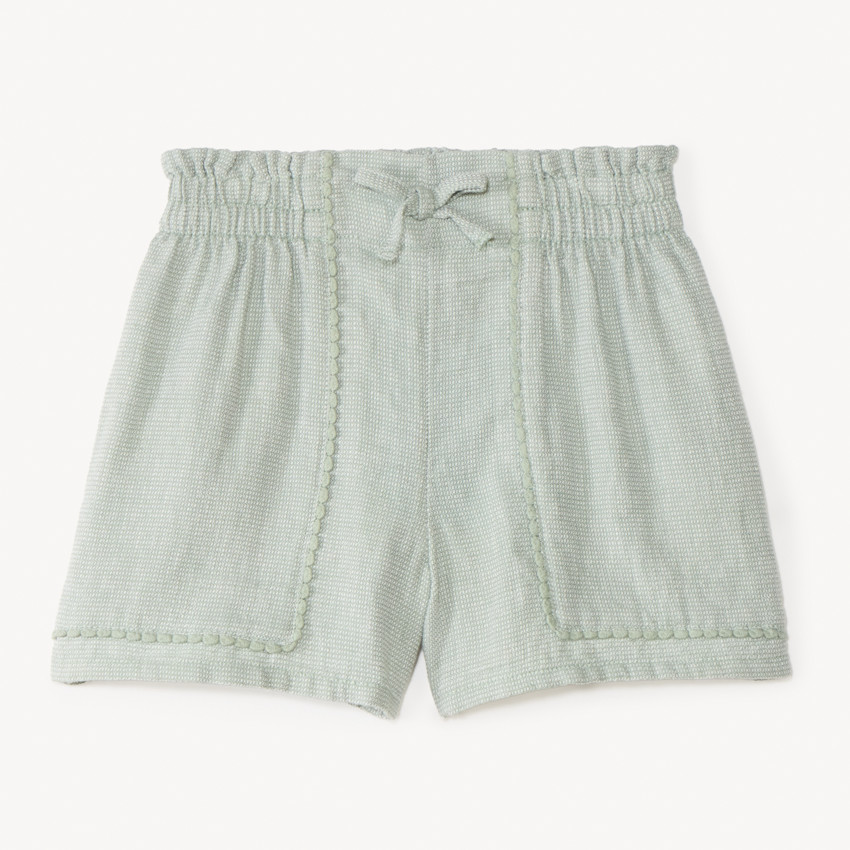 Short de tela con galón de pompones para niña 