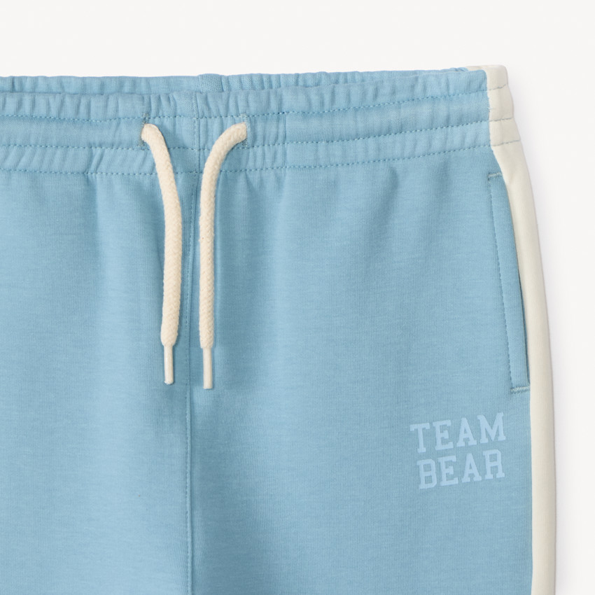 Conjunto de chándal de neopreno con estampado de oso para niño. 