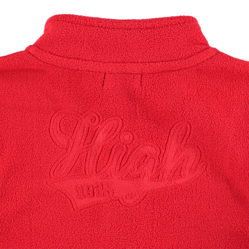 Júnior - Chaqueta polar roja con cremallera e inscripción en relieve por detrás 