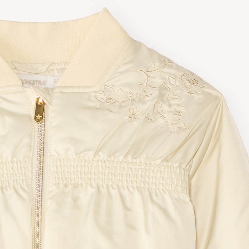 Chaqueta bomber para niña de tela con bordado floral. 