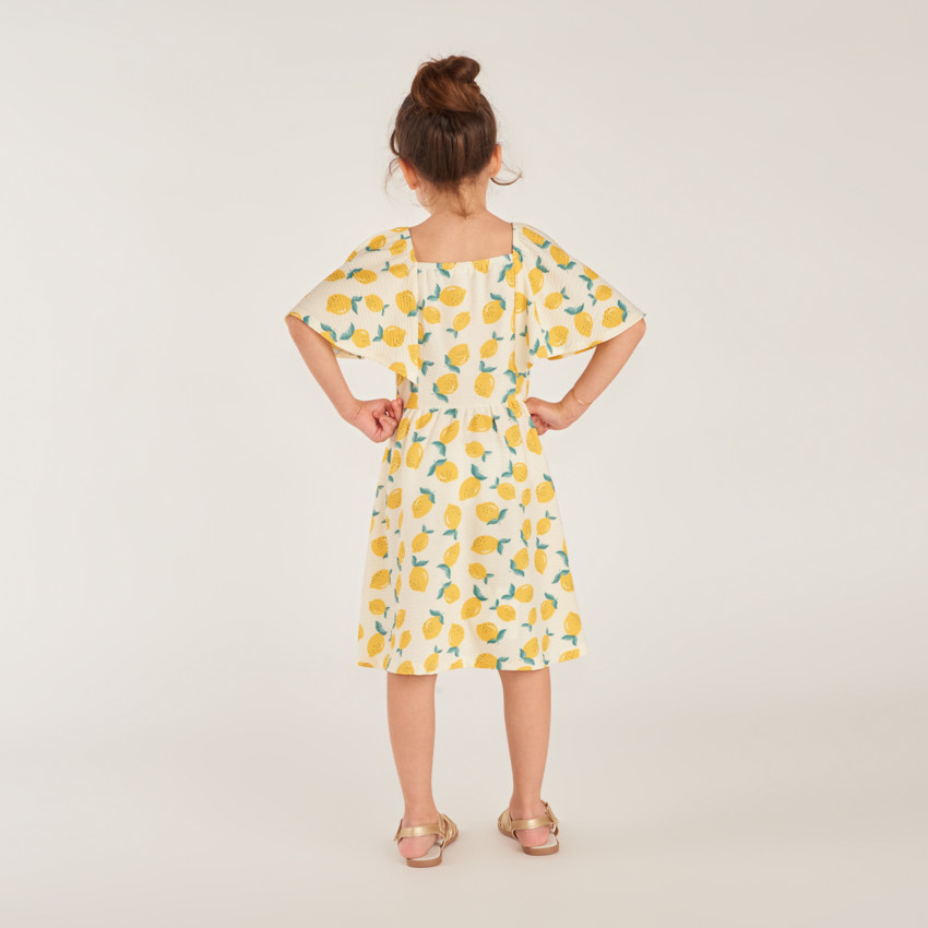 Vestido de manga corta en jersey con estampado de limón para niña. 