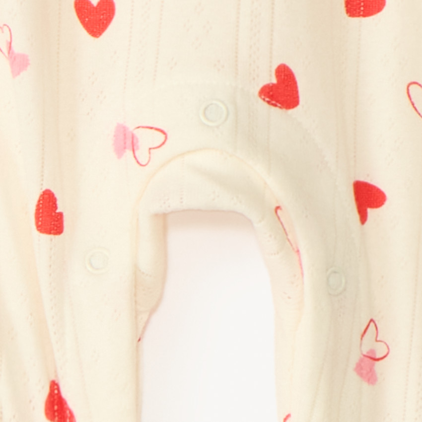 Pelele de punto con estampado de corazones para bebé niña con diferentes aperturas según la edad 