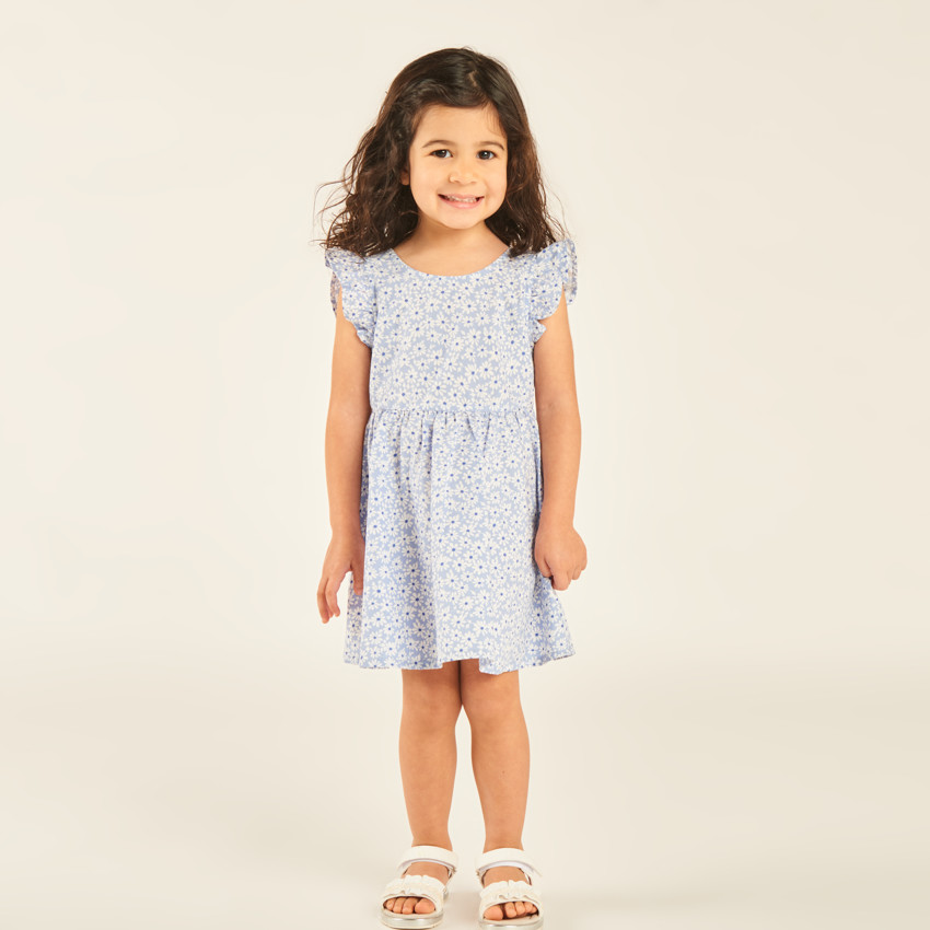 Vestido con estampado floral y espalda pronunciada para niña. 