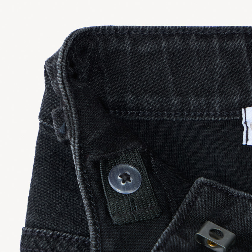 Vaqueros de denim forrados con etiqueta decorativa para niño 