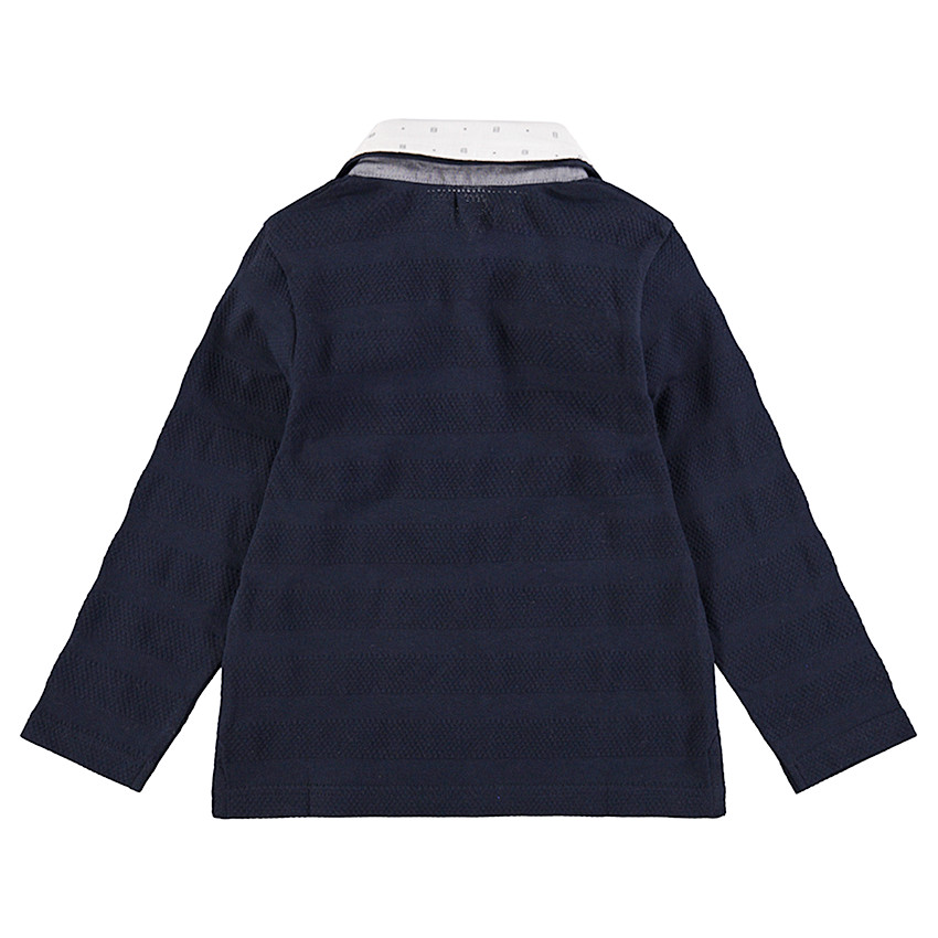 Polo de manga larga con juego de punto a modo de rayas y doble cuello. 