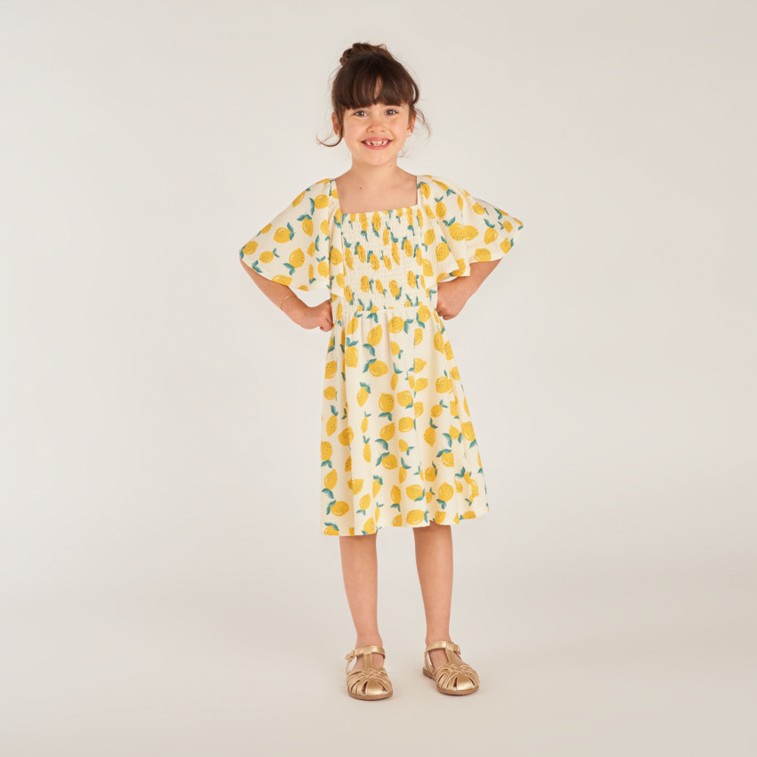 Vestido de manga corta en jersey con estampado de limón para niña. 