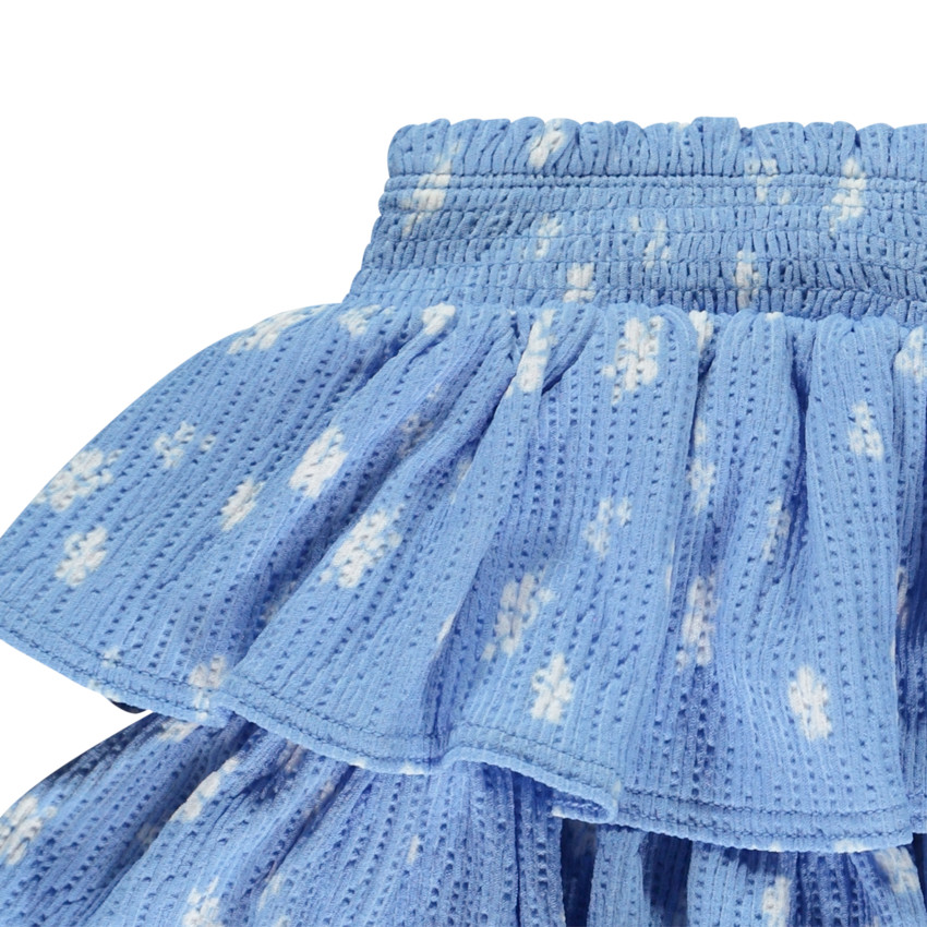 Falda corta de punto calado y estampado con volantes para niña 