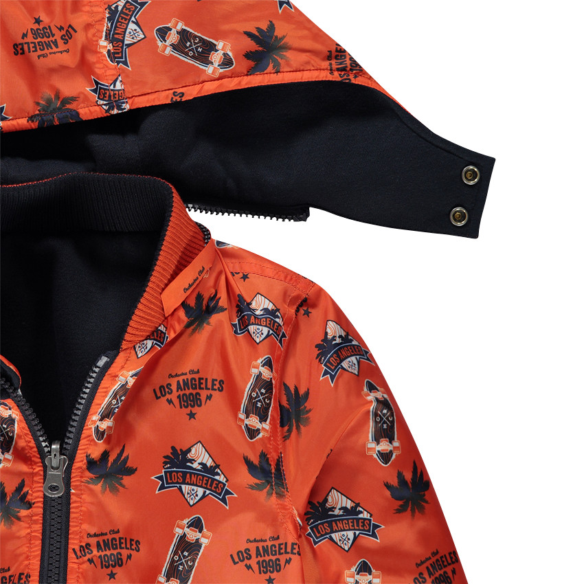 Cortavientos reversible con capucha extraíble estampado/liso 